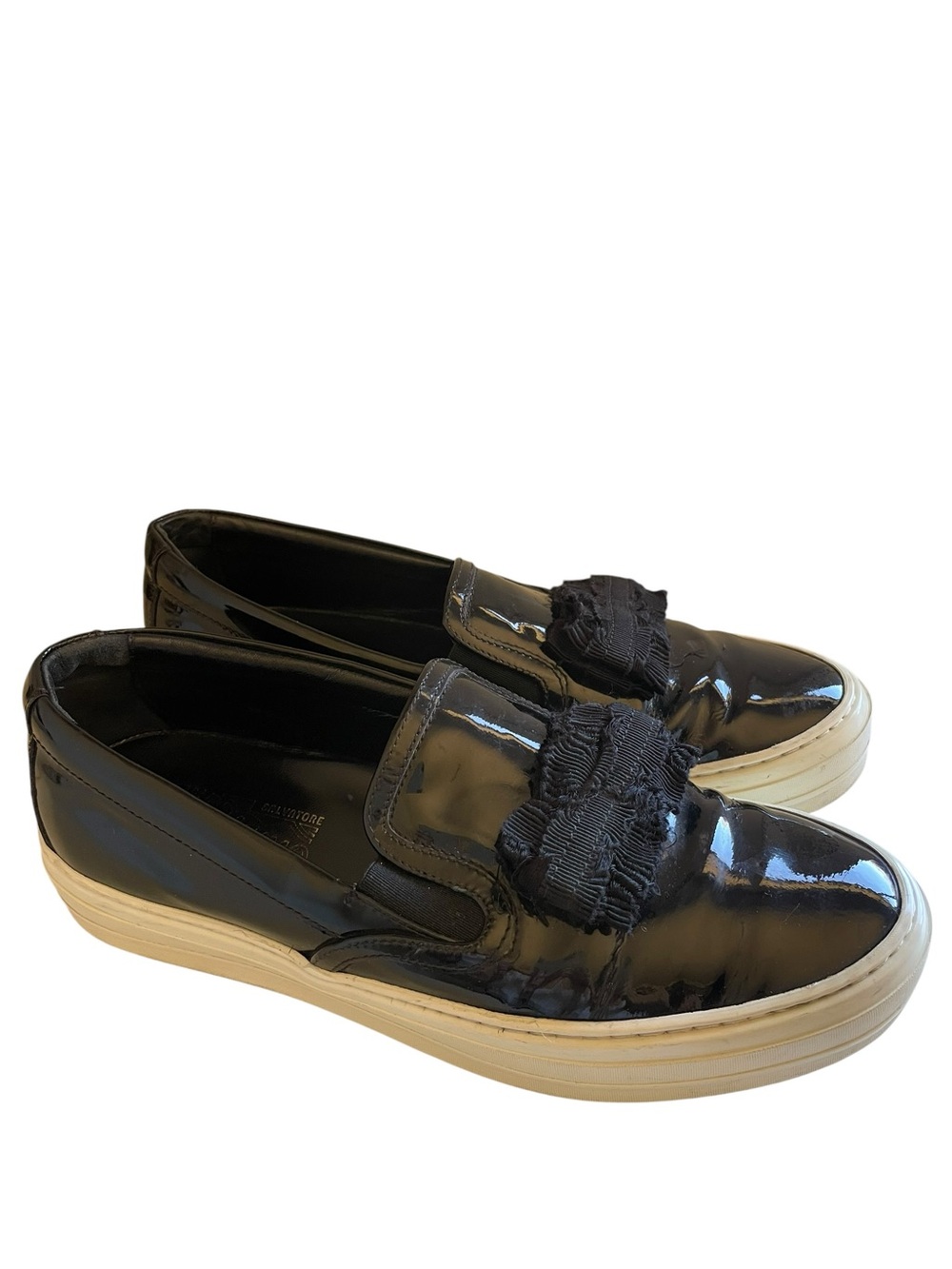 Salvatore Ferragamo Pacau Black Patent Slip-On Sneakers with Fringed Bow